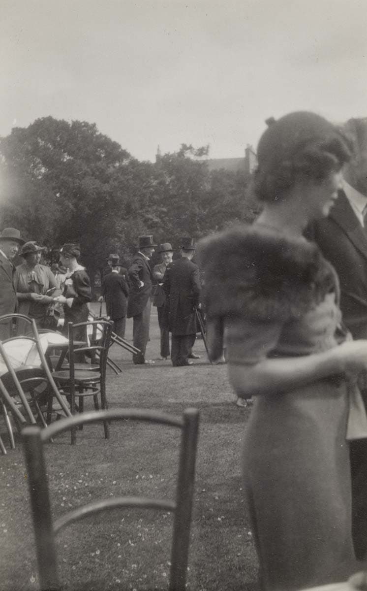 Eliot chatting with fellow guests at a garden party in Edinburgh, July 1937 by Nessie B. Dickson.
