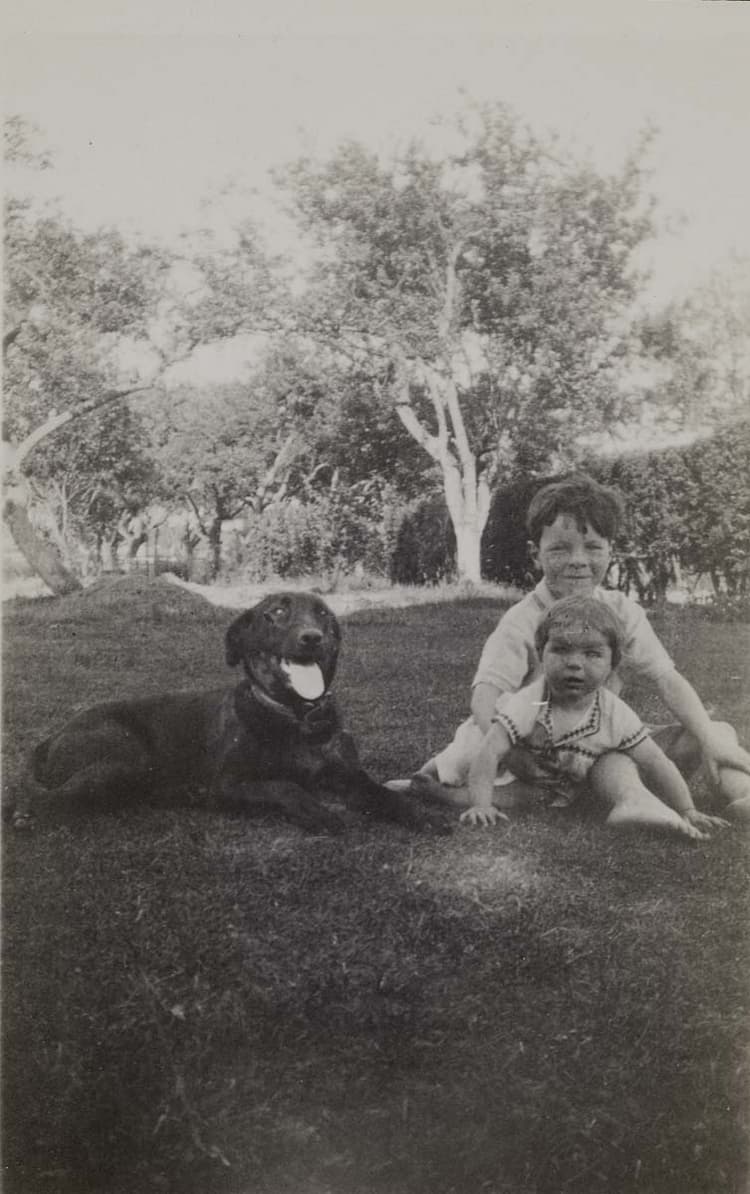 ‘I confess that I very much enjoy the flattery of being liked by children and animals, and rather go out of my way to gain their approval.’ (27 August 1933); Donald and Susanna Morley with Dinah the dog at Pike's Farm in Surrey, 1933.