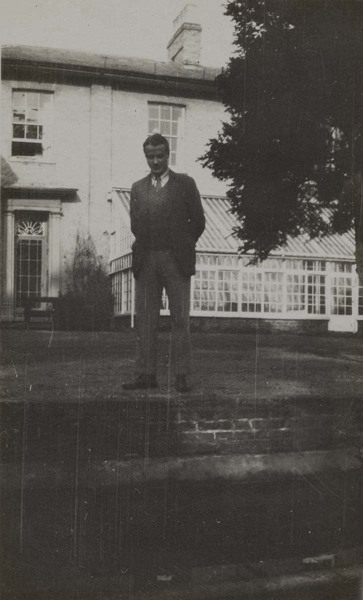 ‘Bonamy is cast for a country gentleman, and he is fundamentally much more an Army type than a University type (he was a Major in the Regular Army before ever he went up to Cambridge); but he can’t afford to keep up a country estate.’ (24 February 1934); Bonamy Dobrée outside his home at Mendham Priory, Norfolk in February 1934.