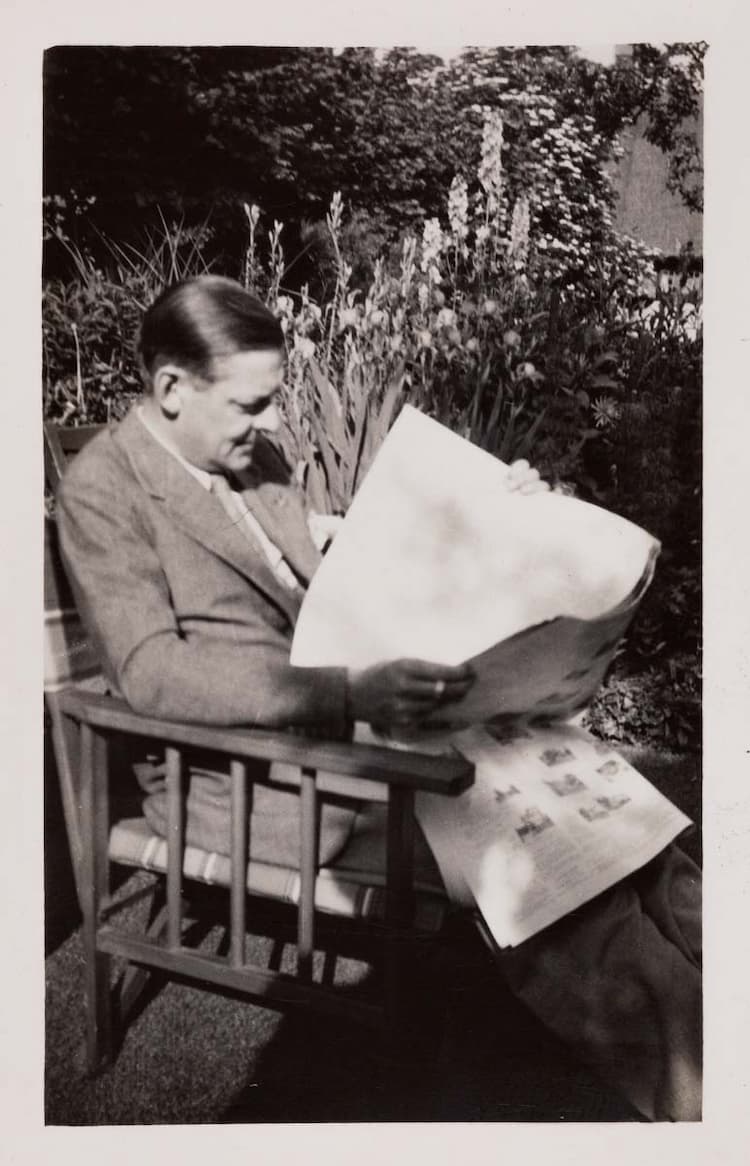 Eliot reading a paper in the garden at Stamford House, Chipping Campden, 1930s.