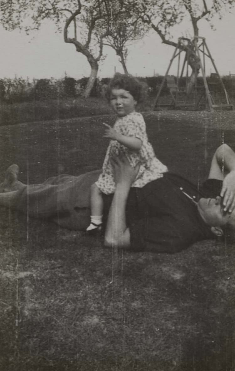 ‘And until the beginning of June shall be equally busy, and then propose to take a fortnight at Lingfield. I am going down there this weekend to Susanna’s birthday’ (7 May 1934); Susanna Morley sitting on her father, Frank Morley, at Pike's Farm, Lingfield, Surrey, May 1934.