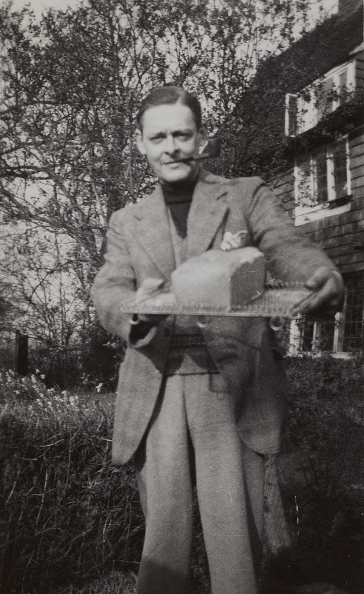 ‘Loaf of bread I made’ (Eliot's caption); Eliot holding a loaf of bread, Pike's Farm, Surrey, ca. April–May 1937.