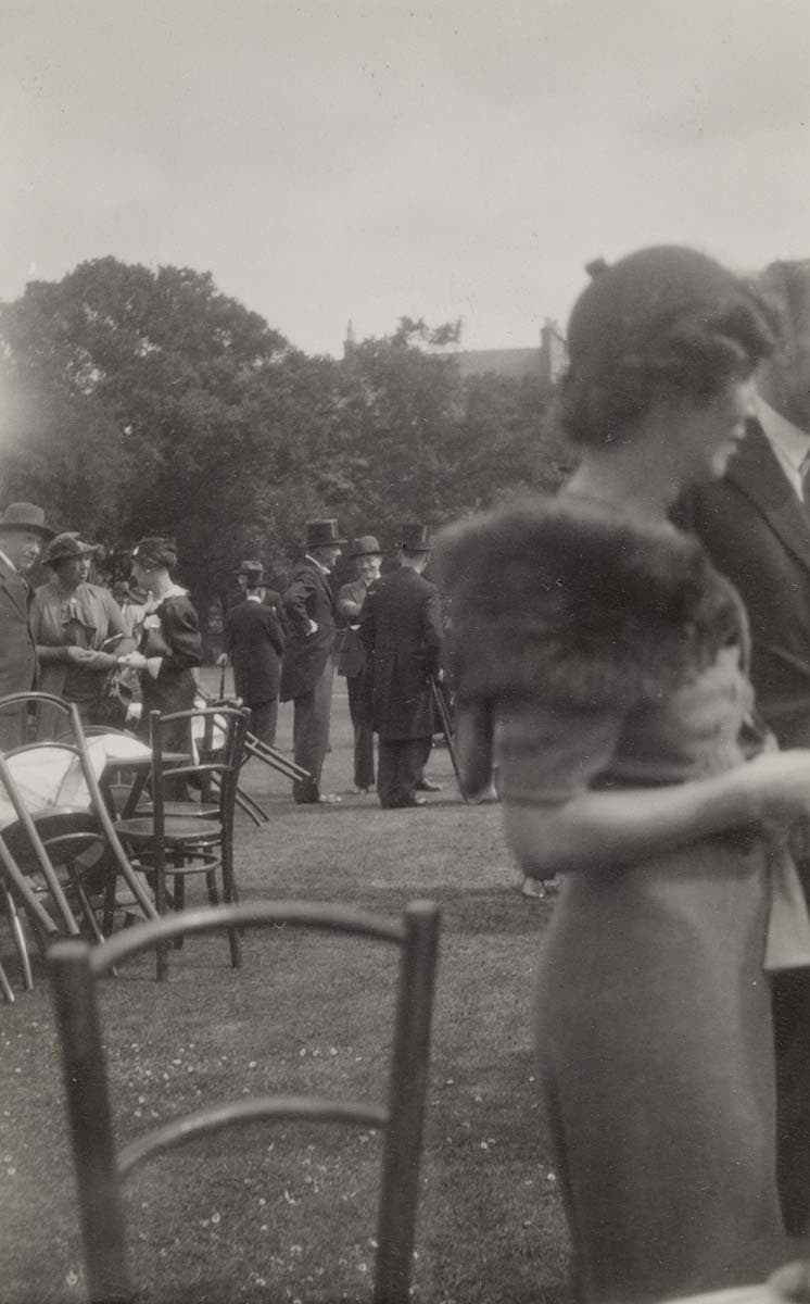 Eliot chatting with fellow guests at a garden party, thought to be in Edinburgh, July 1937.