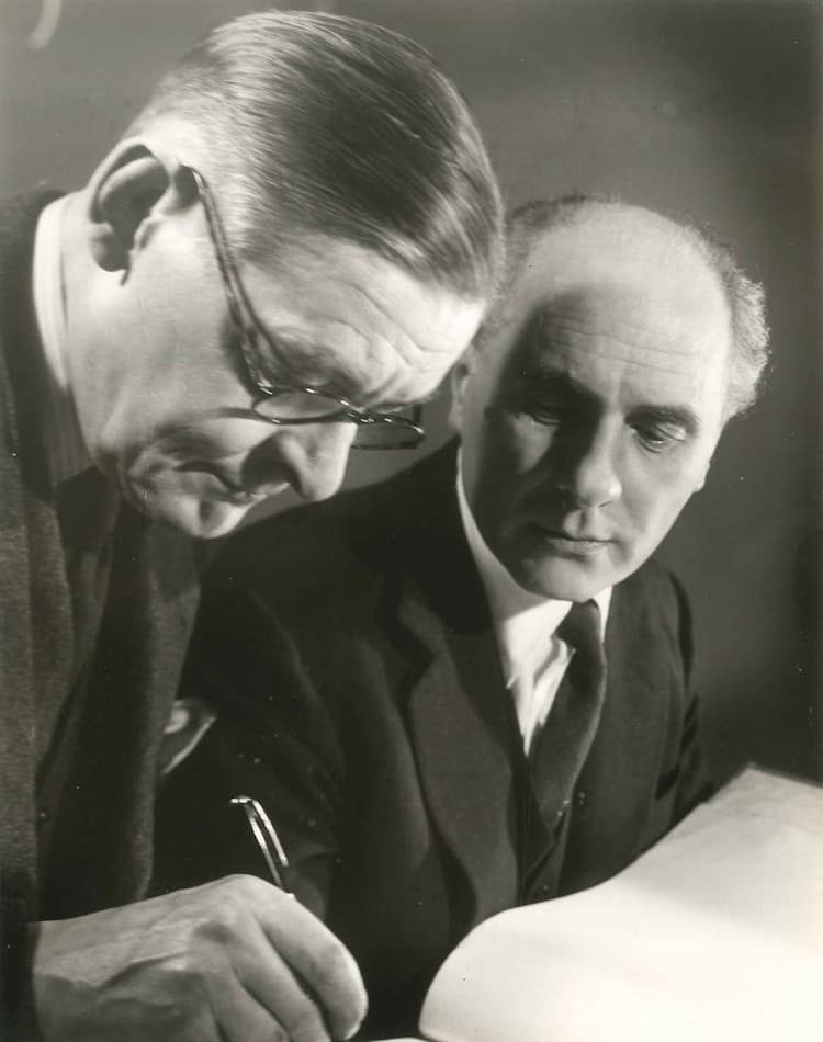 T. S. Eliot and George Hoellering working on the film of Murder in the Cathedral, ca. 1950–1.