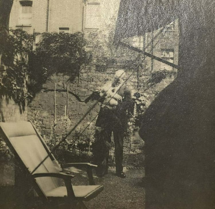 W. L. Janes and George the Cat in the Eliot's garden at 57 Chester Terrace, 1928.